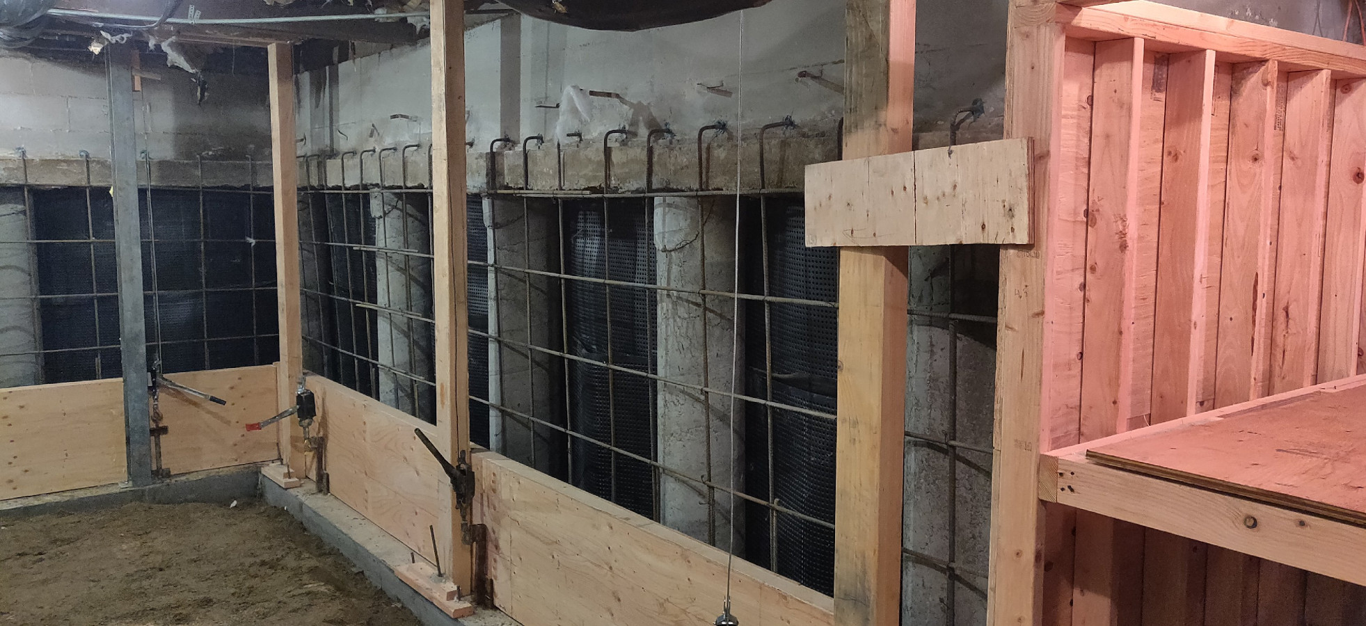 New foundation wall formed and framed beneath an occupied Seattle home