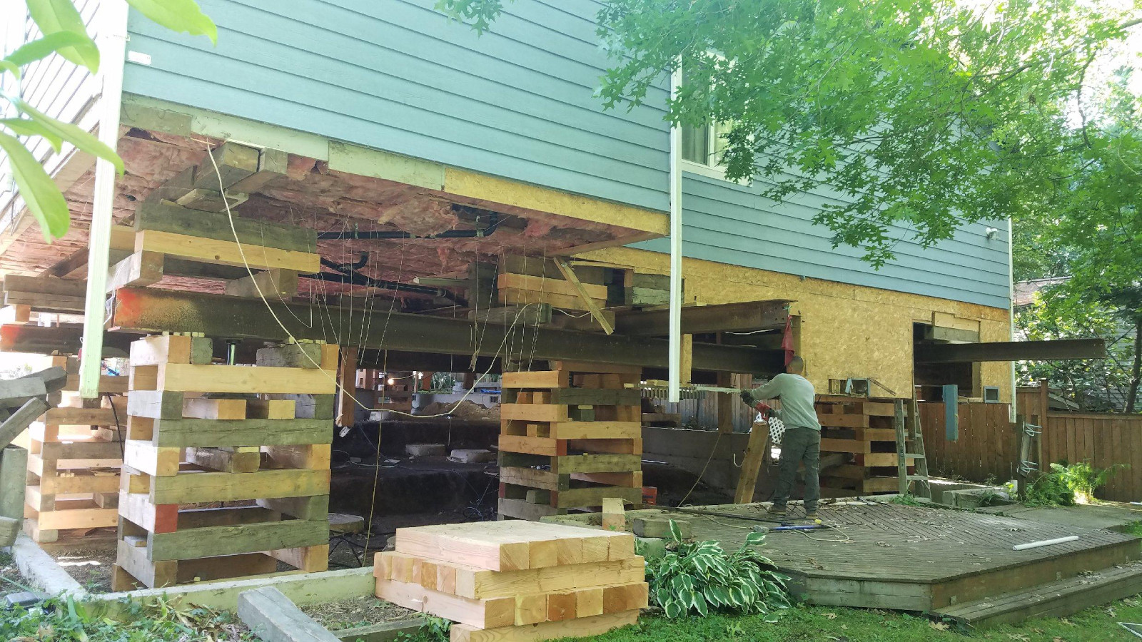 Structural framing going in beneath a raised Seattle home